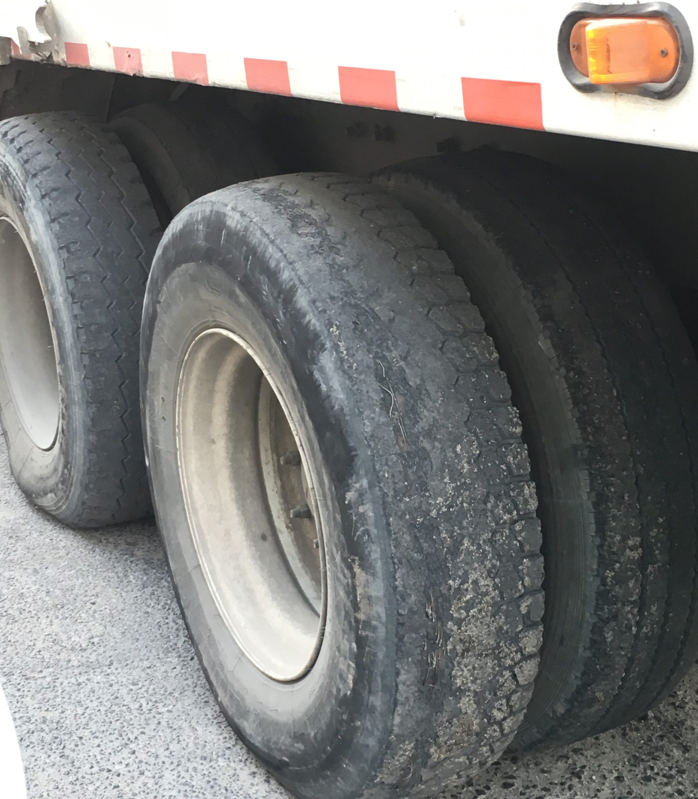 Close-up of truck's dual rear wheels.