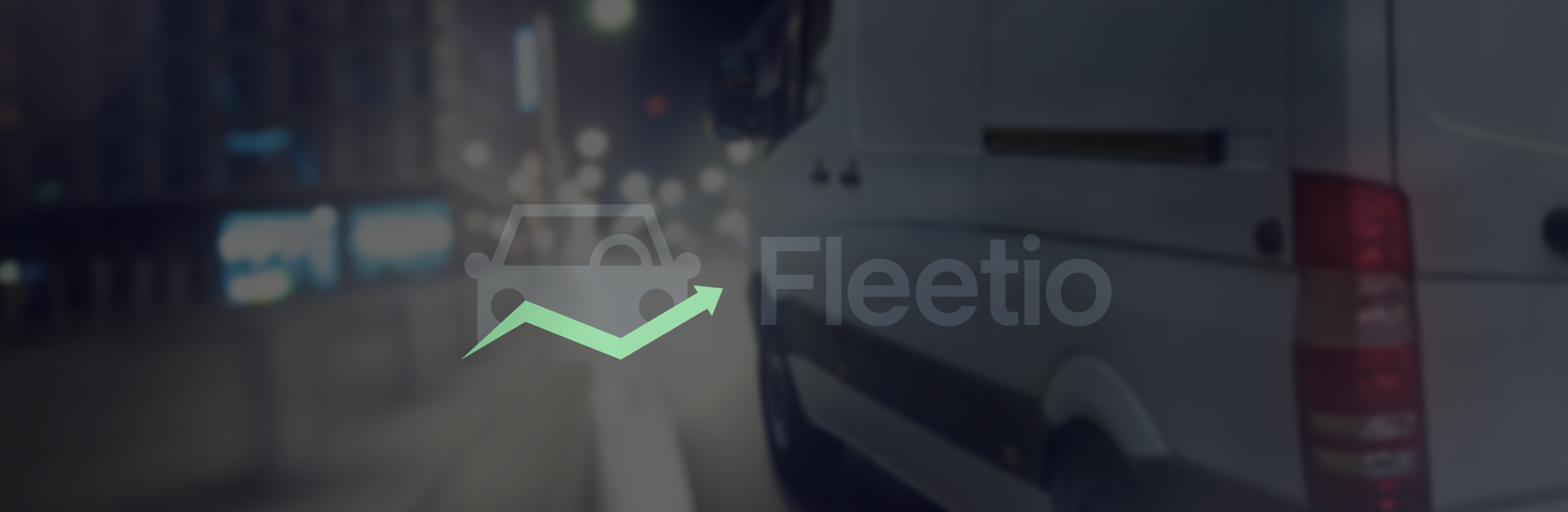 Fleetio brand on blurred urban streetscape background