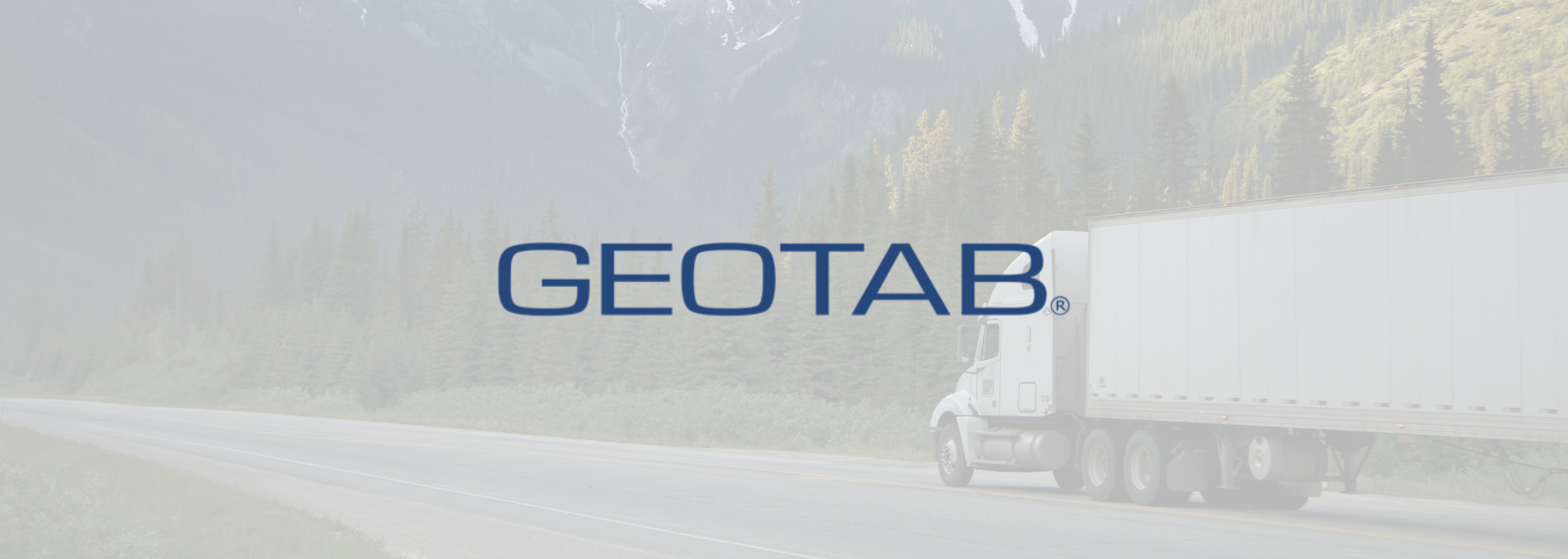 Geotab logo, semi truck on mountain road