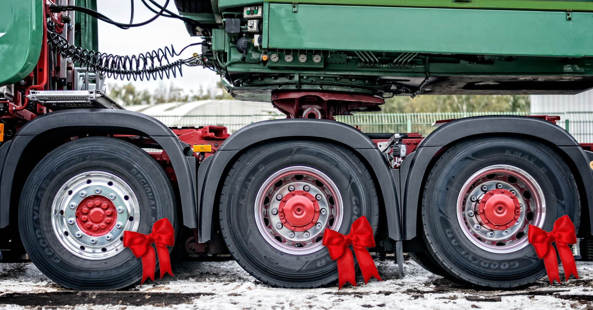 Truck wheels with red ribbon decorations.